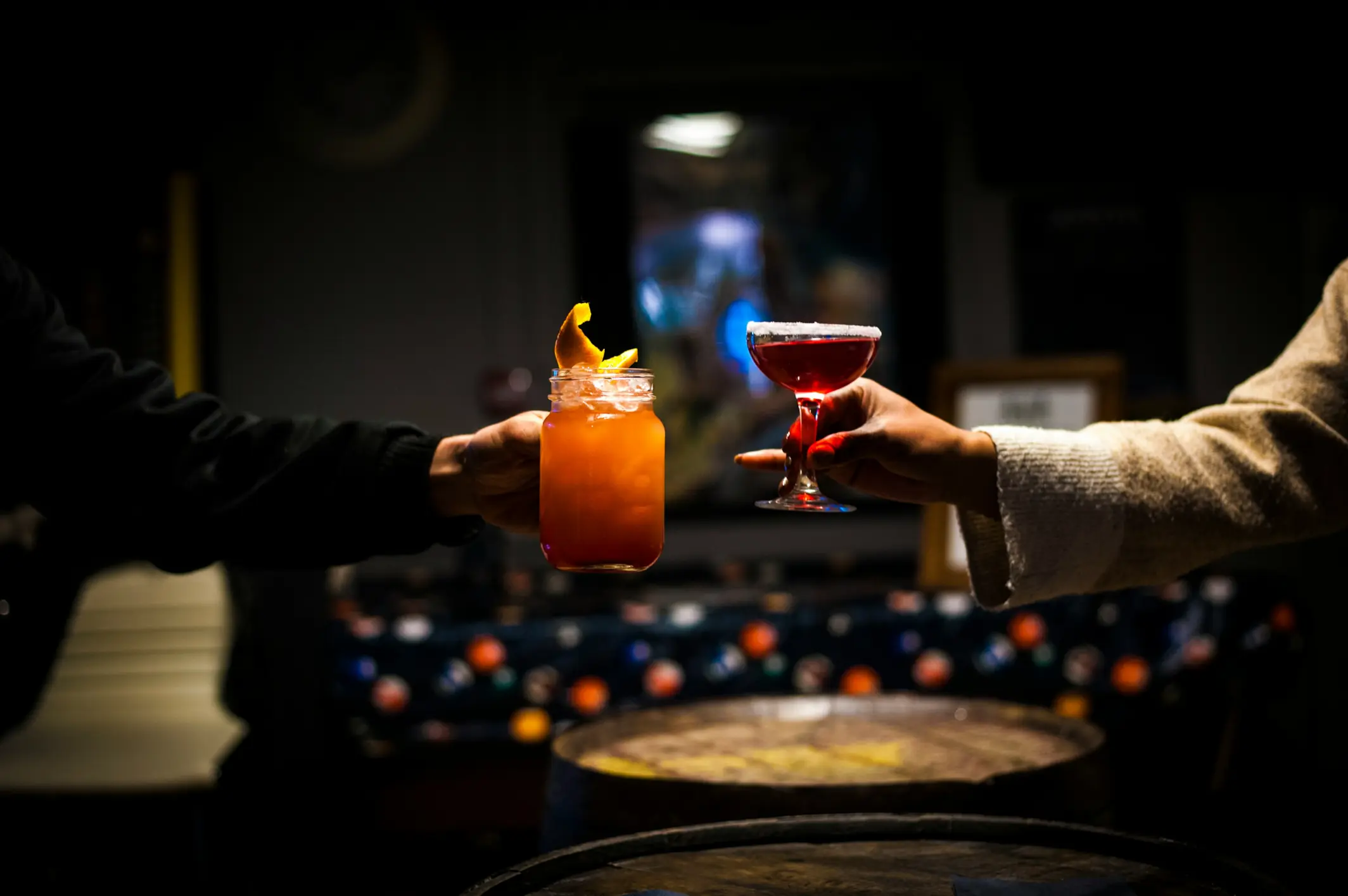 Photo of two people clinking glasses
